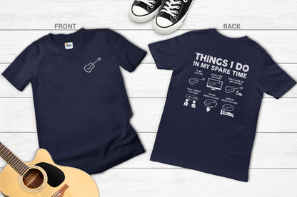Navy blue t-shirt with guitar graphic on front and text on back, displayed on a wooden surface.