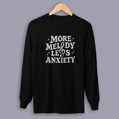 Person wearing the More Melody Less Anxiety mental health music long sleeve shirt