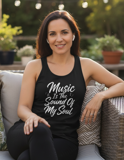 A black sleeveless tank top with white script text reading 'Music Is The Sound Of My Soul' on the front, shown against a solid gray background. The neck label shows the Gildan brand logo.